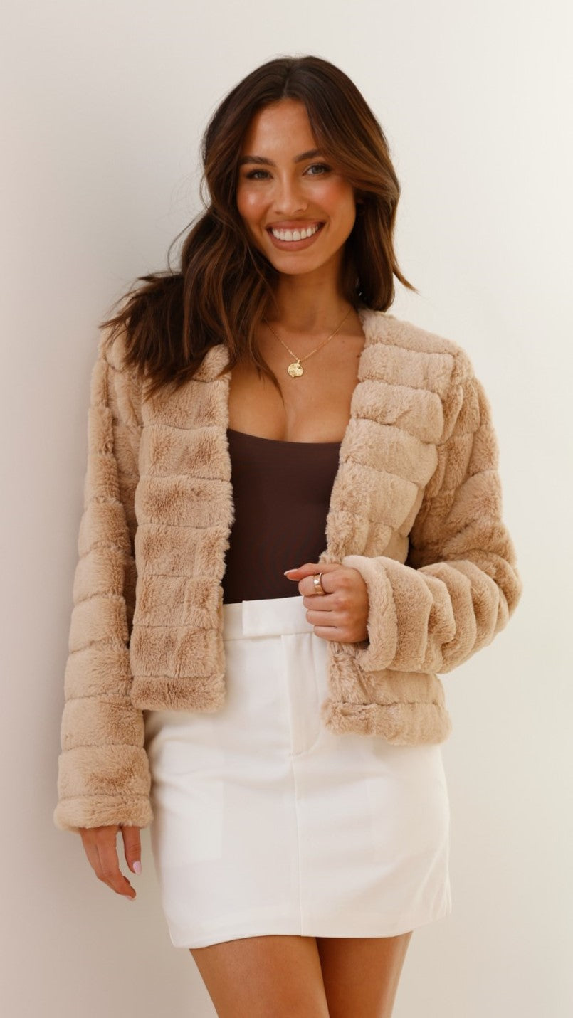 Fashionable striped cropped jacket for women. Perfect for fall & winter chic.
