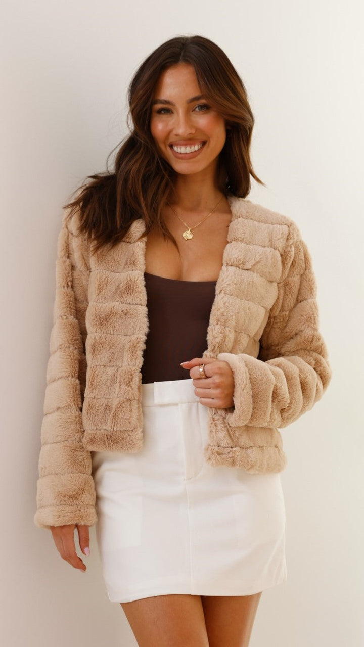 Fashionable striped cropped jacket for women. Perfect for fall & winter chic.