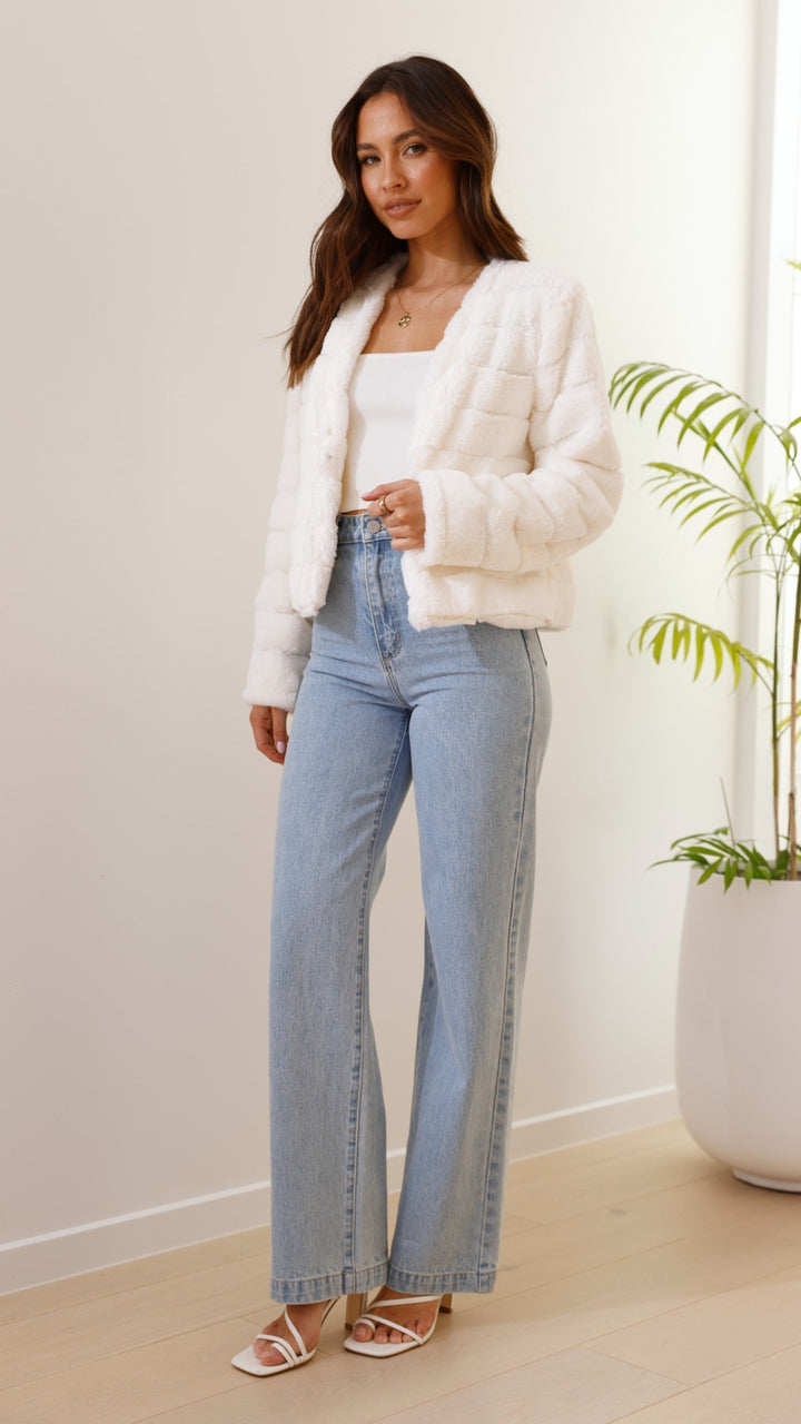 Winter fashion: women's stylish striped cropped jacket. Warm & trendy outerwear.
