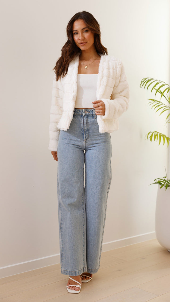 Stylish striped cropped jacket, perfect for modern women's fall fashion.