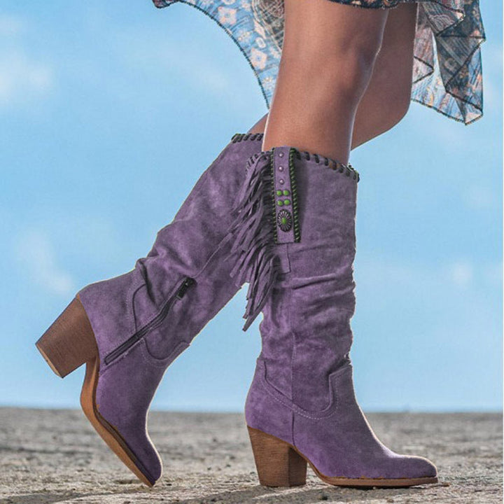Stylish women's western boots with studded & fringe detail, knee-high design, ideal for casual wear.