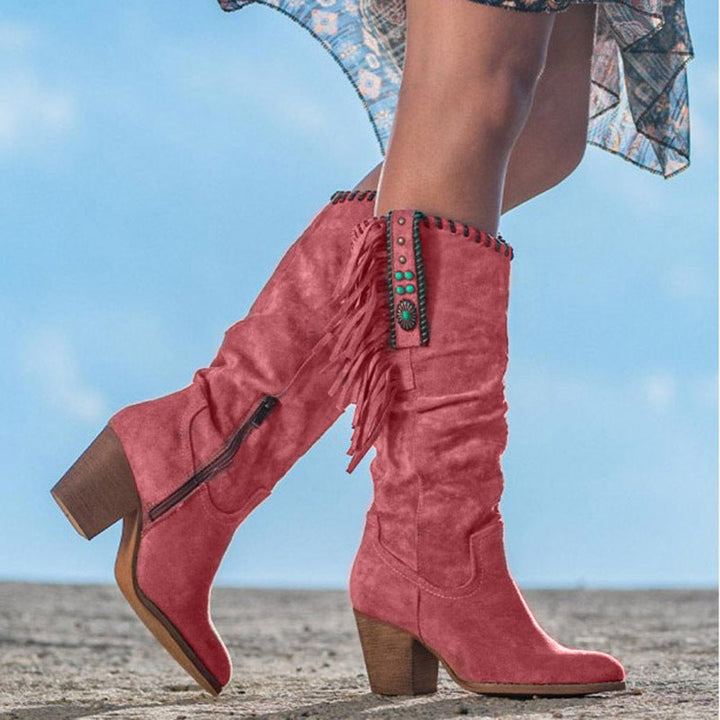 Dakota women's western knee-high boots featuring a block heel, pointed toe, and chic studded accents.
