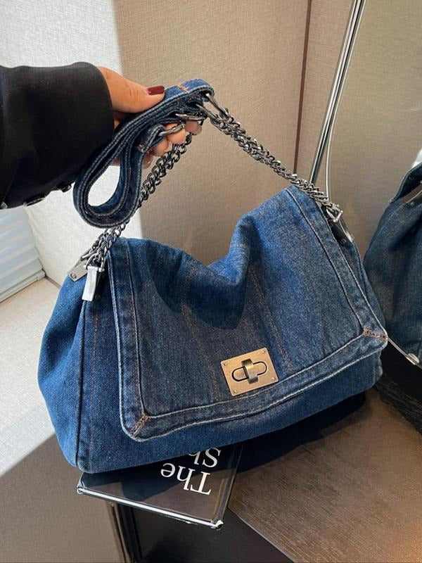Women's light denim shoulder bag featuring a stylish chain strap. A casual yet chic denim handbag.