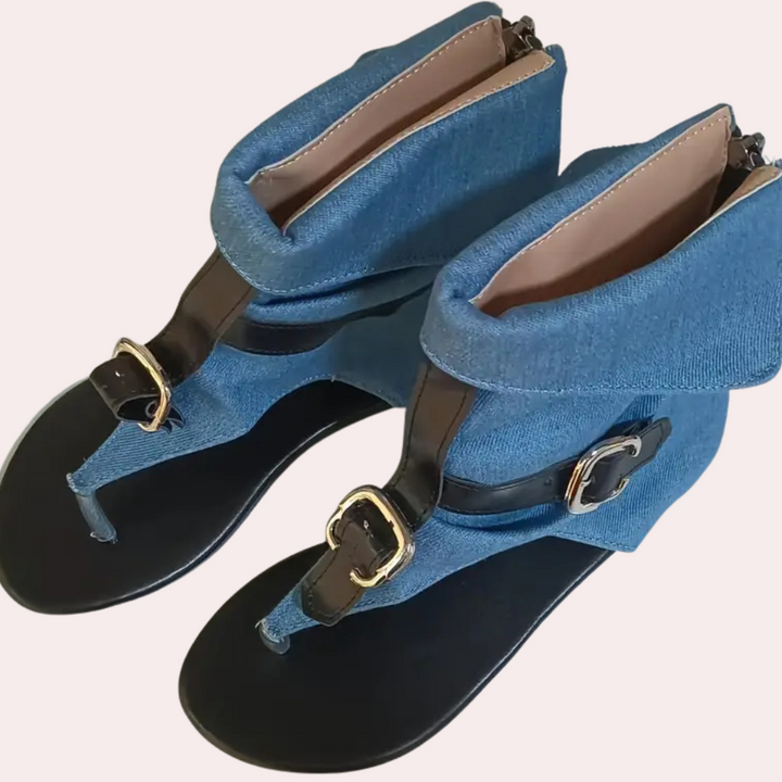 Trendy denim flat sandals for women, perfect for a casual summer look. Fashionable and comfortable beach footwear.