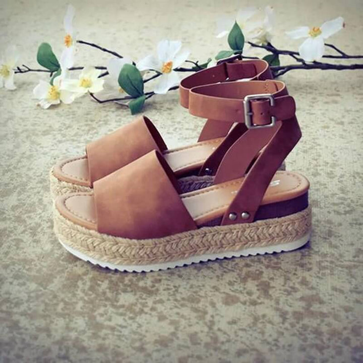 Elegant women's espadrille wedge sandals, ideal summer shoes with ankle strap.