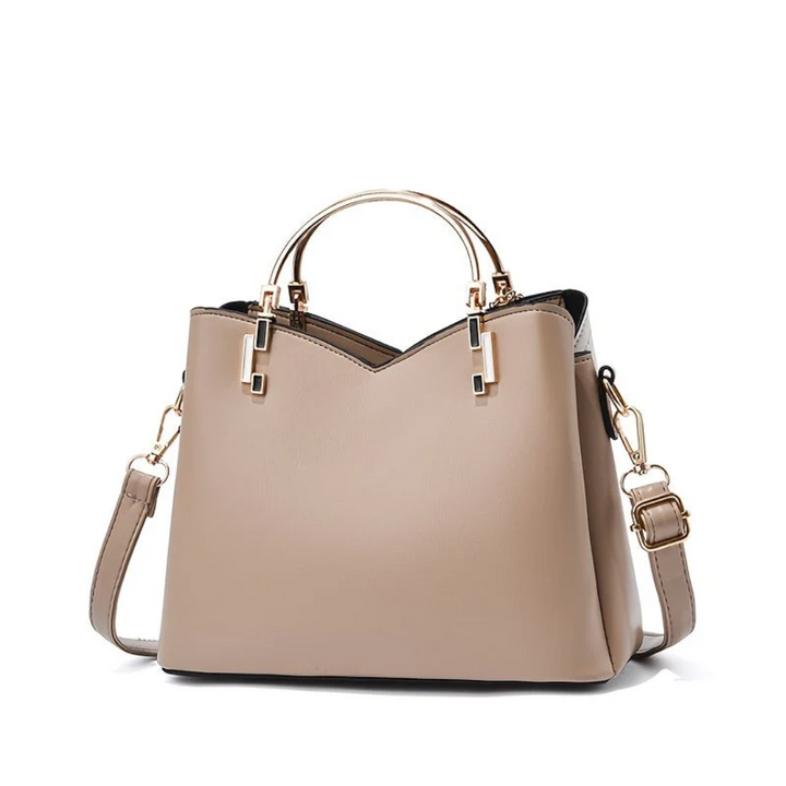 Chic women's faux leather everyday handbag. Versatile shoulder bag fashion accessory.