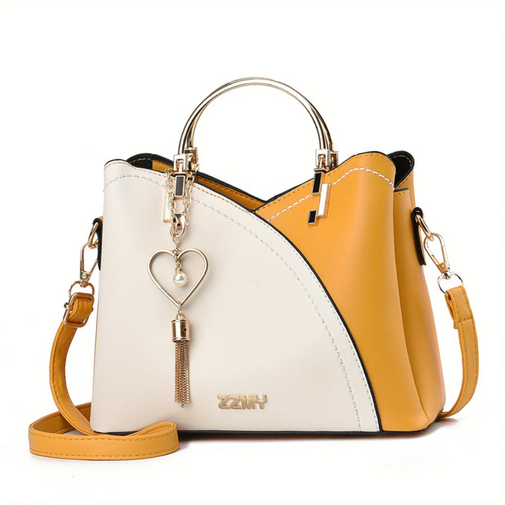 Modern white faux leather women's shoulder bag. Elegant versatile everyday handbag.