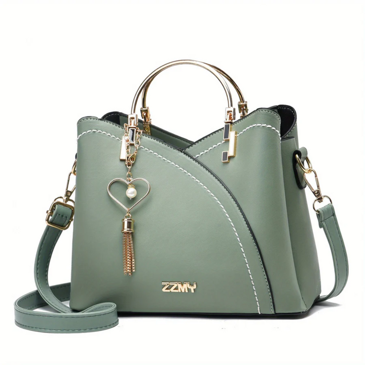 Fashion-forward women's faux leather handbag. Stylish everyday shoulder bag.