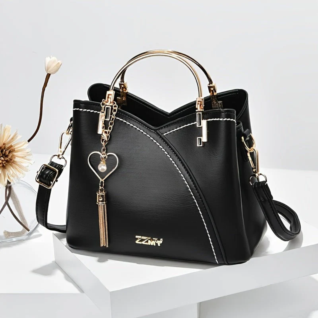 Compact women's faux leather handbag. Chic versatile everyday shoulder bag purse.