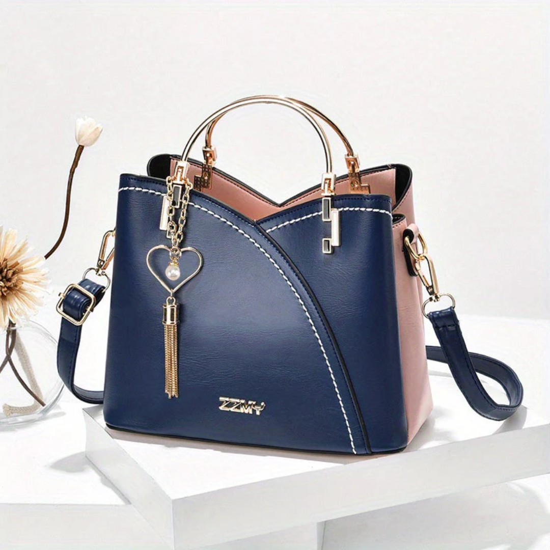 Spacious women's shoulder bag. Elegant faux leather versatile everyday handbag.