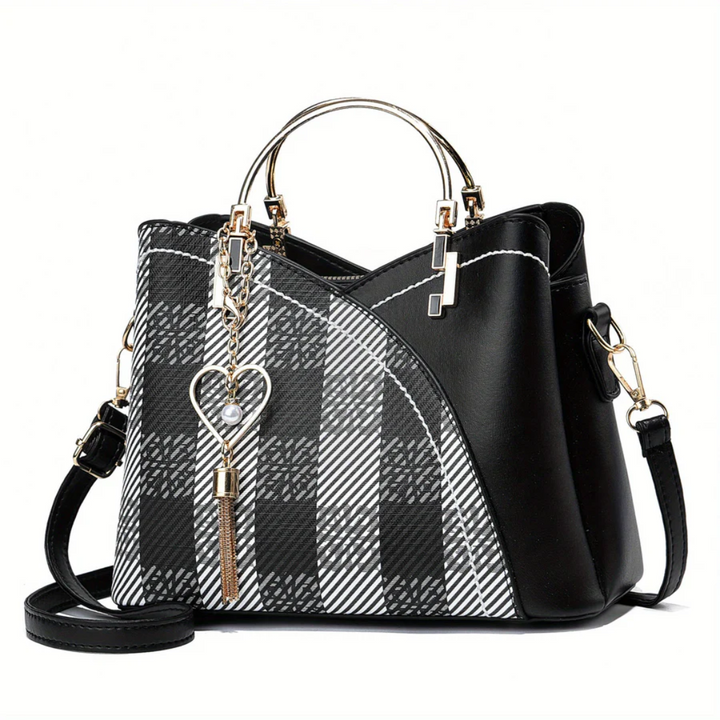 Stylish brown faux leather women's handbag. Elegant versatile everyday shoulder bag.