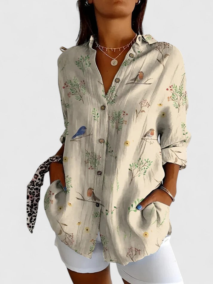 Elegant women's floral blouse with v-neck, short sleeves, ideal for chic office wear or stylish casual outings.
