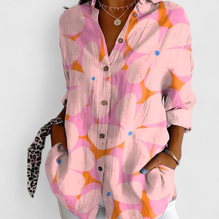 Stylish women's floral pattern blouse featuring a flattering v-neck and comfortable short sleeves for ladies' apparel.