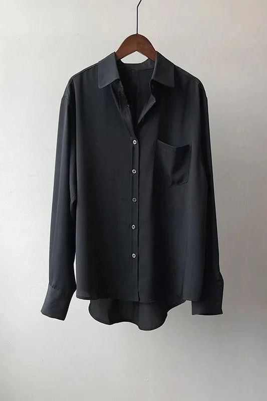 Effortless chic women's flowy blouse, ideal for spring and summer fashion. Relaxed fit top.