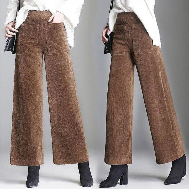 Chic women's high-waisted flared trousers with patch pockets, perfect for versatile casual or semi-formal fashion.