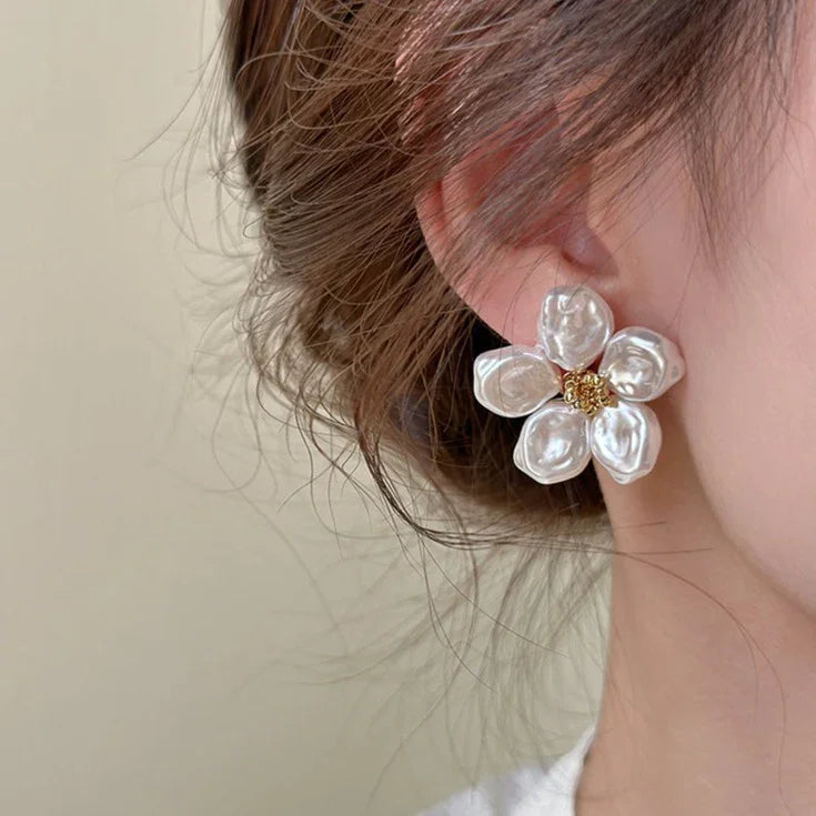 Chic women's irregular pearl petal earrings. Artistic design with unique pearls, a stylish statement piece.