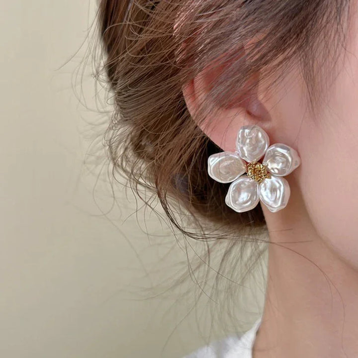 Chic women's irregular pearl petal earrings. Artistic design with unique pearls, a stylish statement piece.