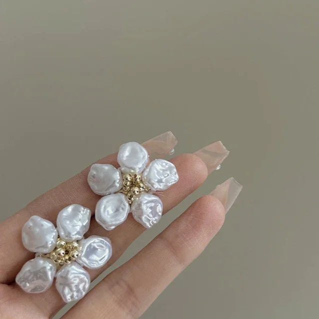 Women's irregular pearl petal earrings. Unique design, perfect for adding a chic touch to any outfit.