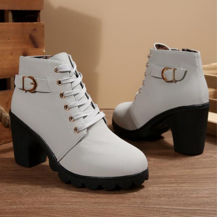 Elegant women's chunky ankle boots with lace-up detail & sturdy block heel. Perfect for a chic, confident look.