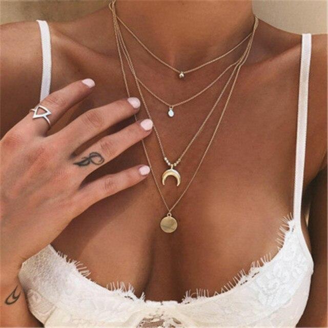 Chic women's layered necklace with a delicate half moon pendant. Boho jewelry for a modern accessory look.