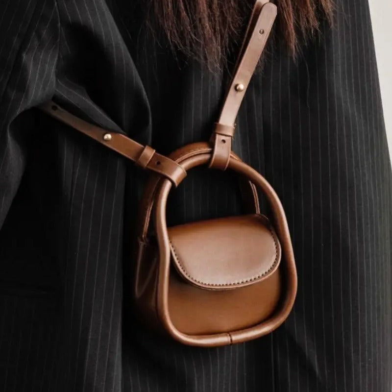 Chic women's leather crossbody bag with adjustable strap, perfect for everyday use.