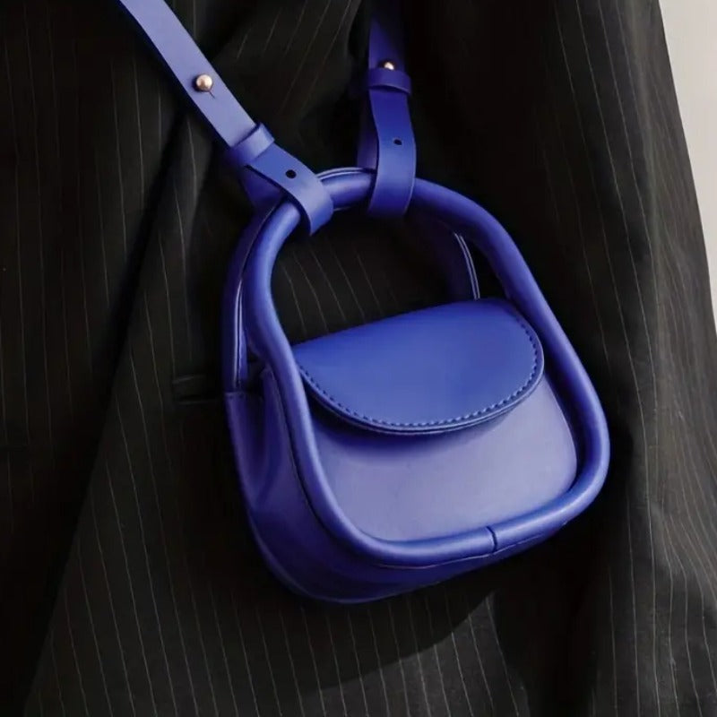 Versatile women's leather crossbody bag, ideal for daily essentials and hands-free style.