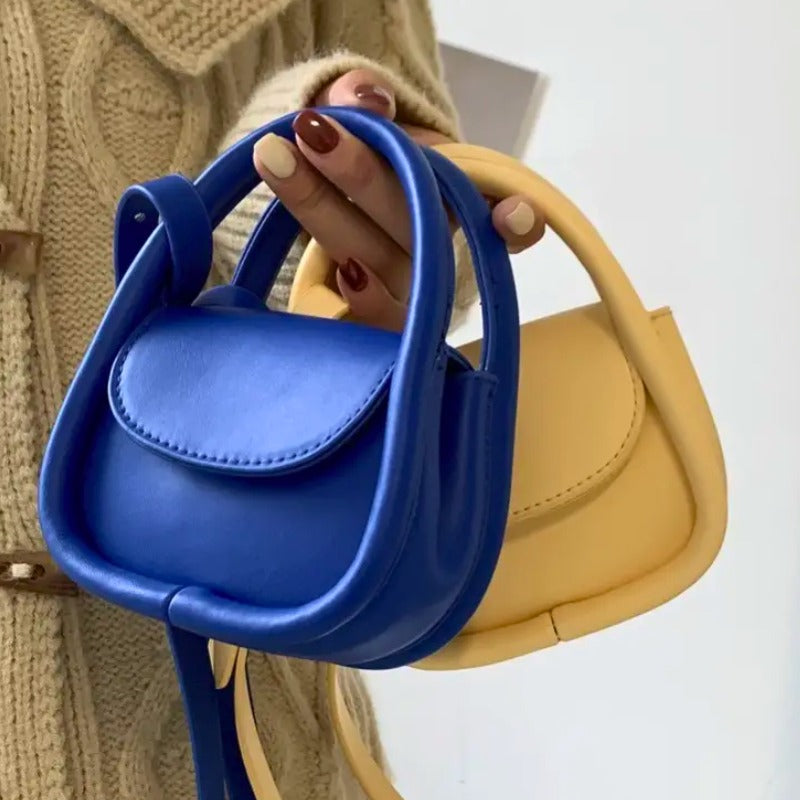 Elegant women's leather crossbody with snap closure, a perfect small everyday bag.