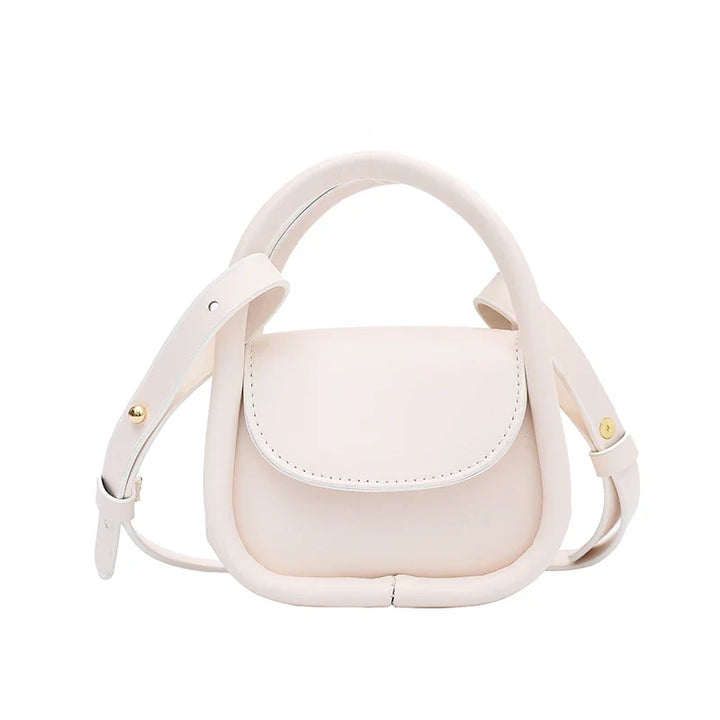 Women's small leather crossbody shoulder bag, featuring a convenient snap closure.