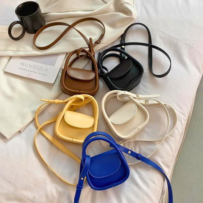 Sophisticated women's leather crossbody, a small chic shoulder bag with adjustable strap.