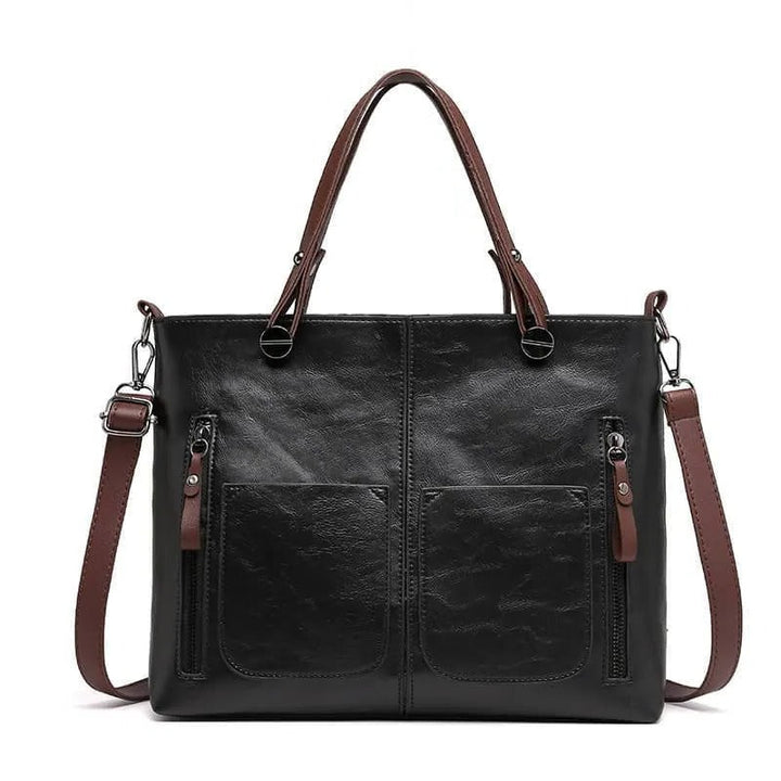 Elegant black leather work bag for women, organized tote with multiple zippered pockets.