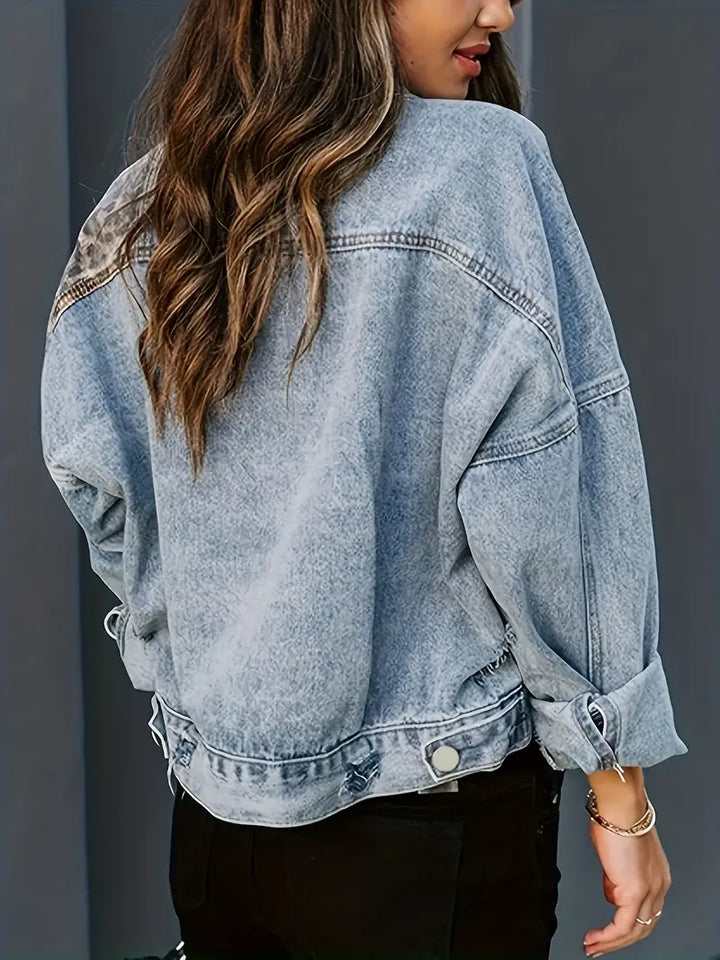 Stylish women's denim jacket featuring a vibrant leopard print, ideal for a chic street look.