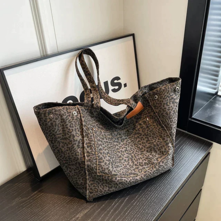 Spacious leopard print shoulder bag for women, a trendy chic fashion accessory.