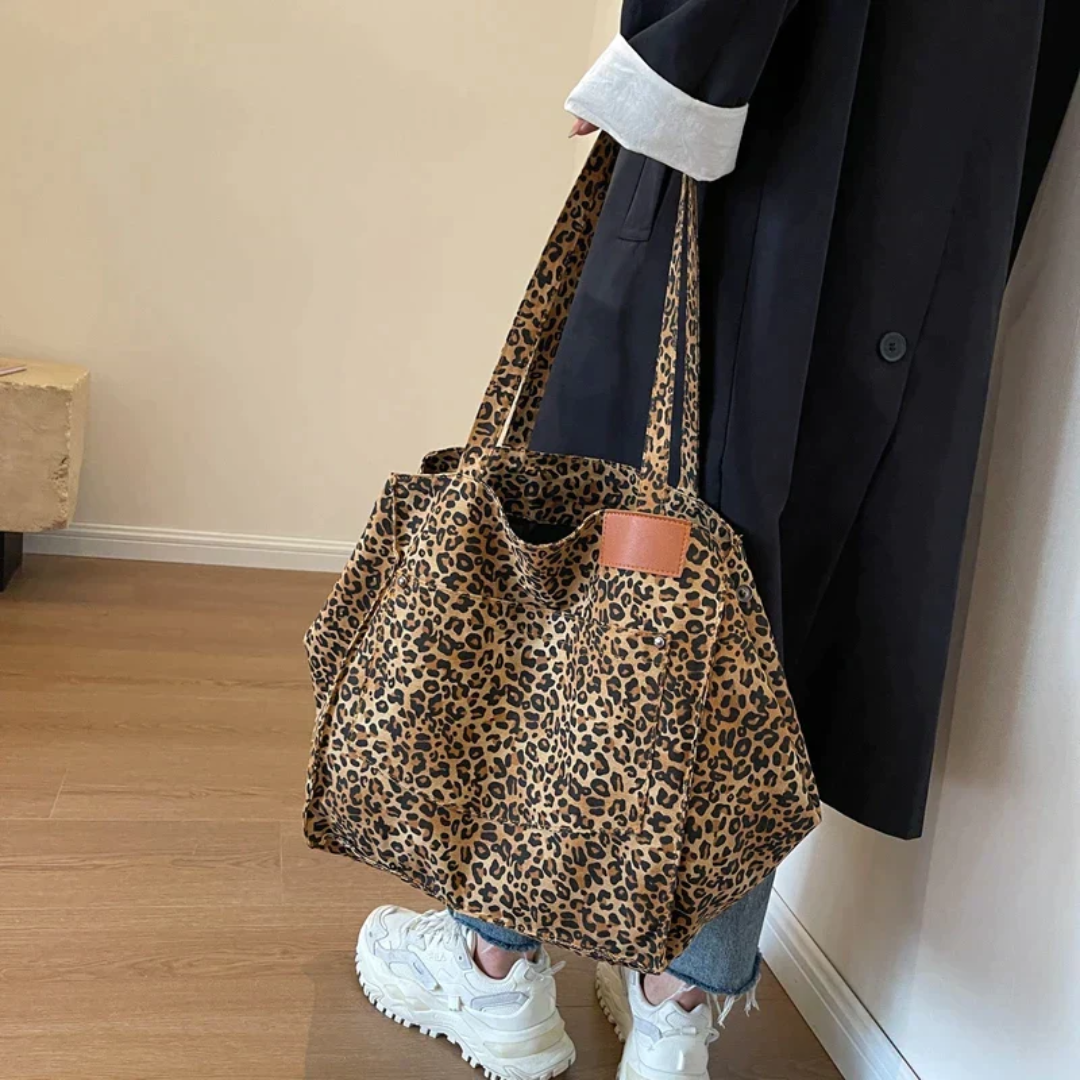 Stylish women's leopard print handbag, perfect statement accessory & everyday carry bag.