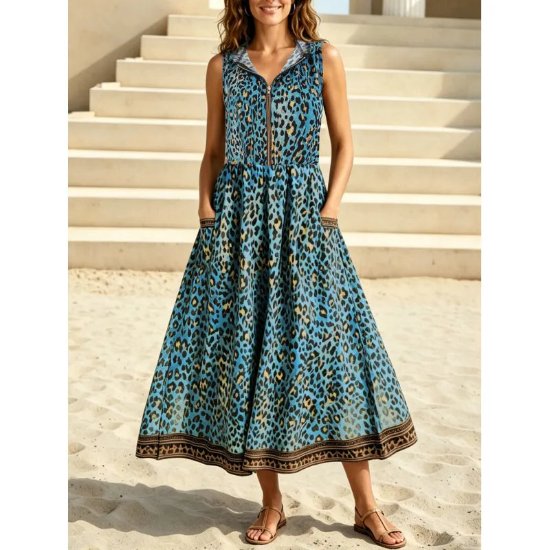 Comfortable women's sleeveless maxi dress. Features bold leopard print, practical hood, and front zipper.