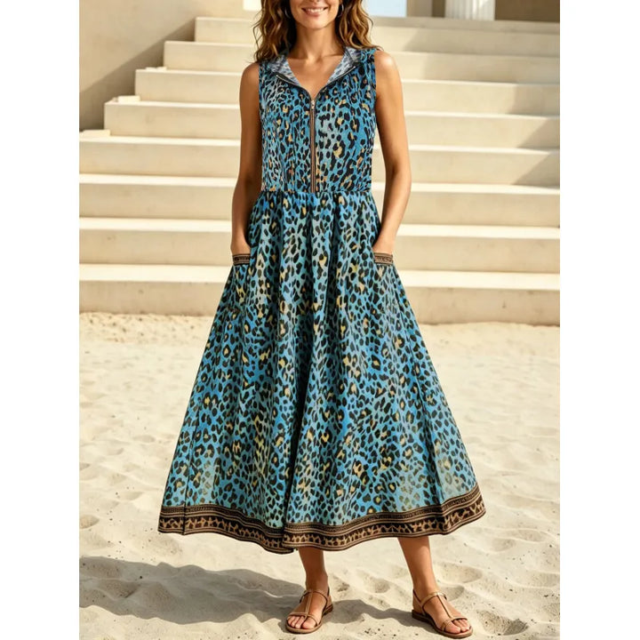 Comfortable women's sleeveless maxi dress. Features bold leopard print, practical hood, and front zipper.