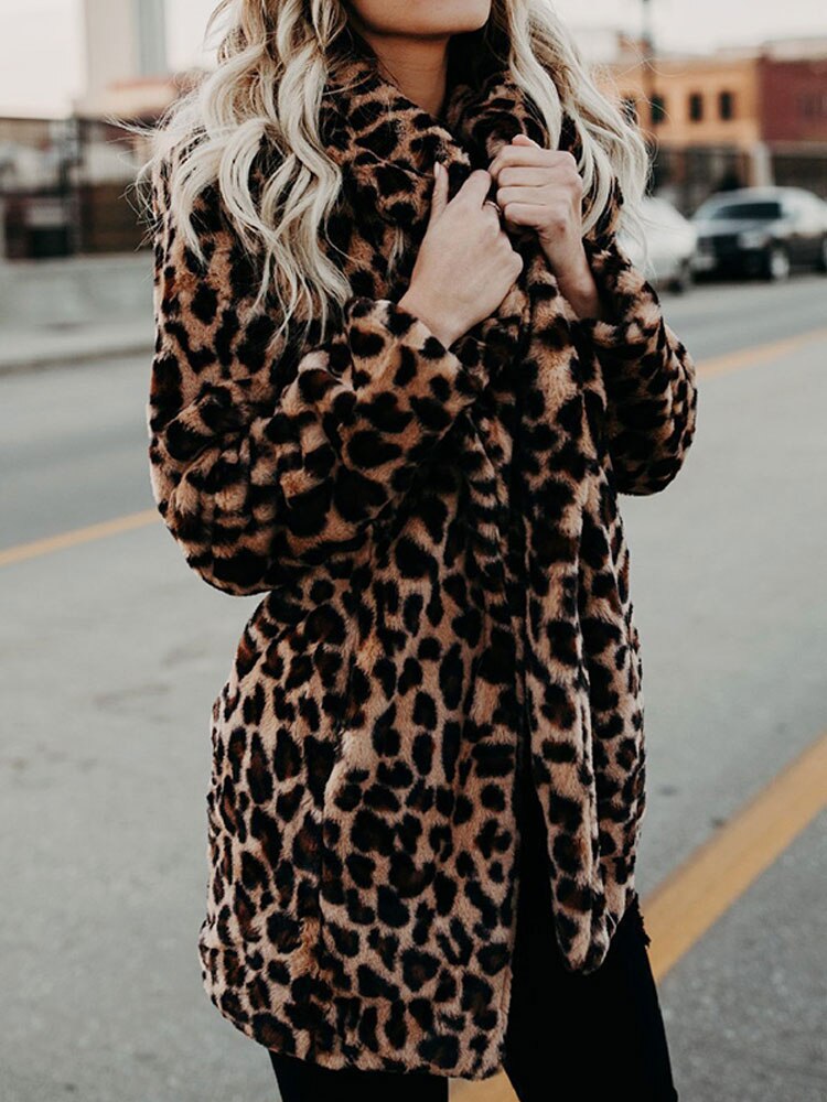 Elegant women's leopard print long winter coat, a sophisticated animal print outerwear.