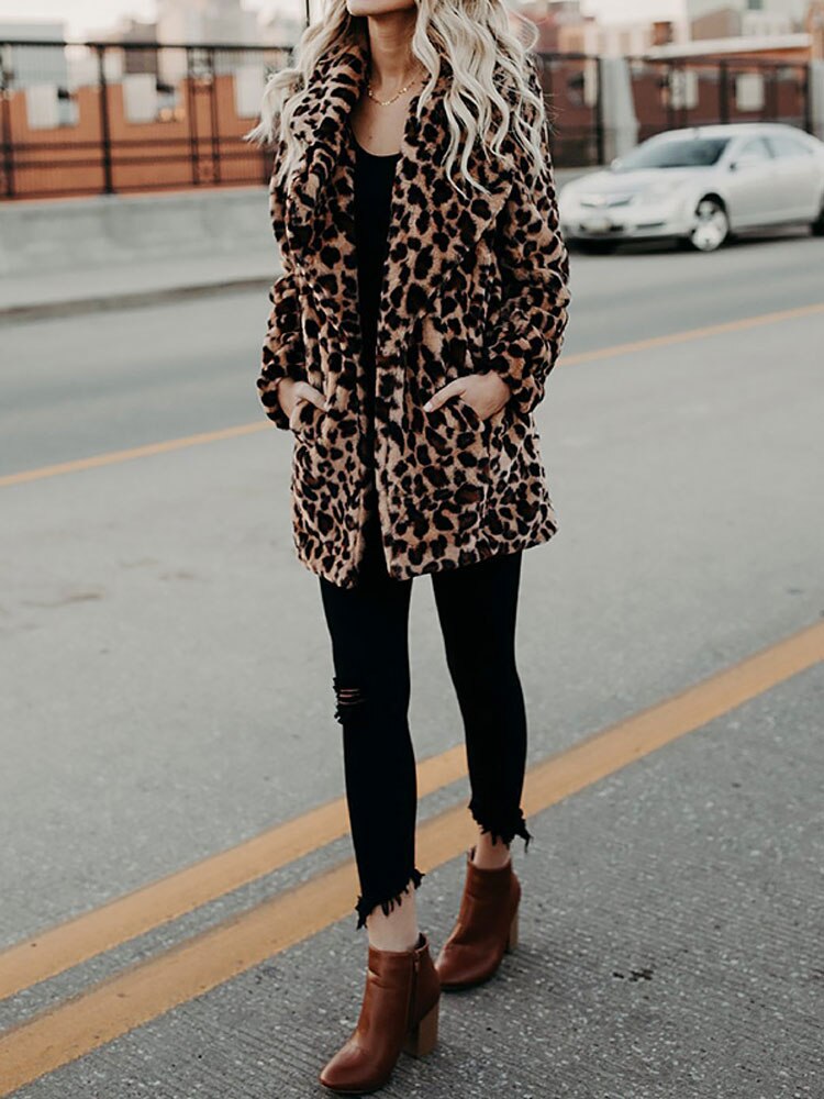 Bold women's leopard print winter jacket, a cozy and fashionable statement piece for cold days.