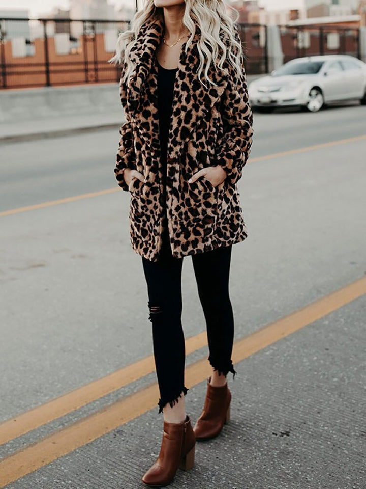 Bold women's leopard print winter jacket, a cozy and fashionable statement piece for cold days.