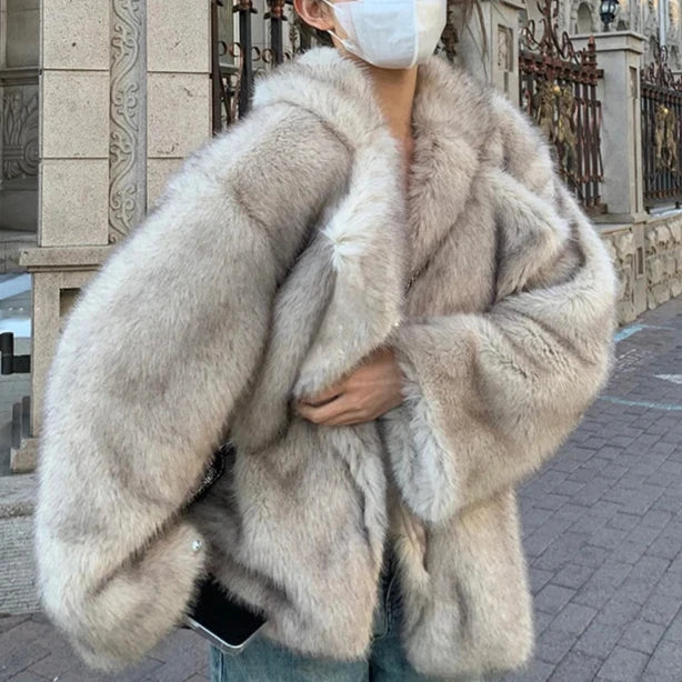 Chic women's luxurious soft coat in a neutral color, perfect for elegant and timeless winter outerwear. Cozy and stylish.