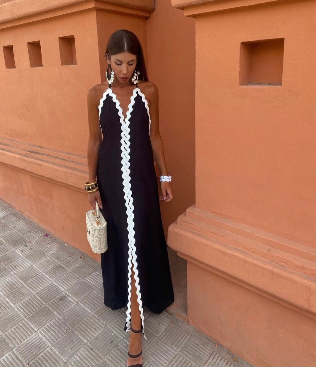 Chic women's maxi wedding guest dress with elegant contrast trim and V-neck, perfect for summer occasions.
