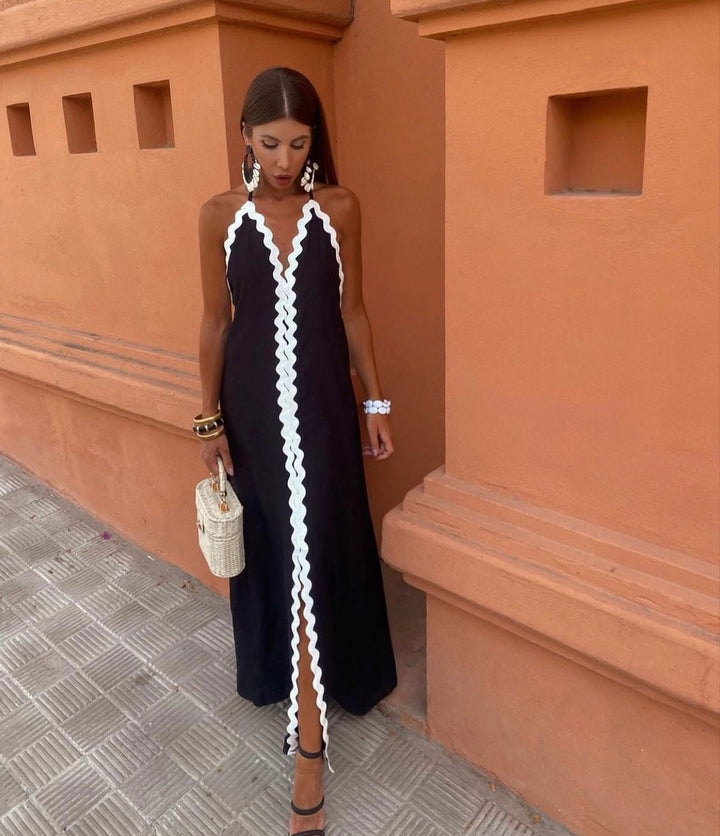 Chic women's maxi wedding guest dress with elegant contrast trim and V-neck, perfect for summer occasions.