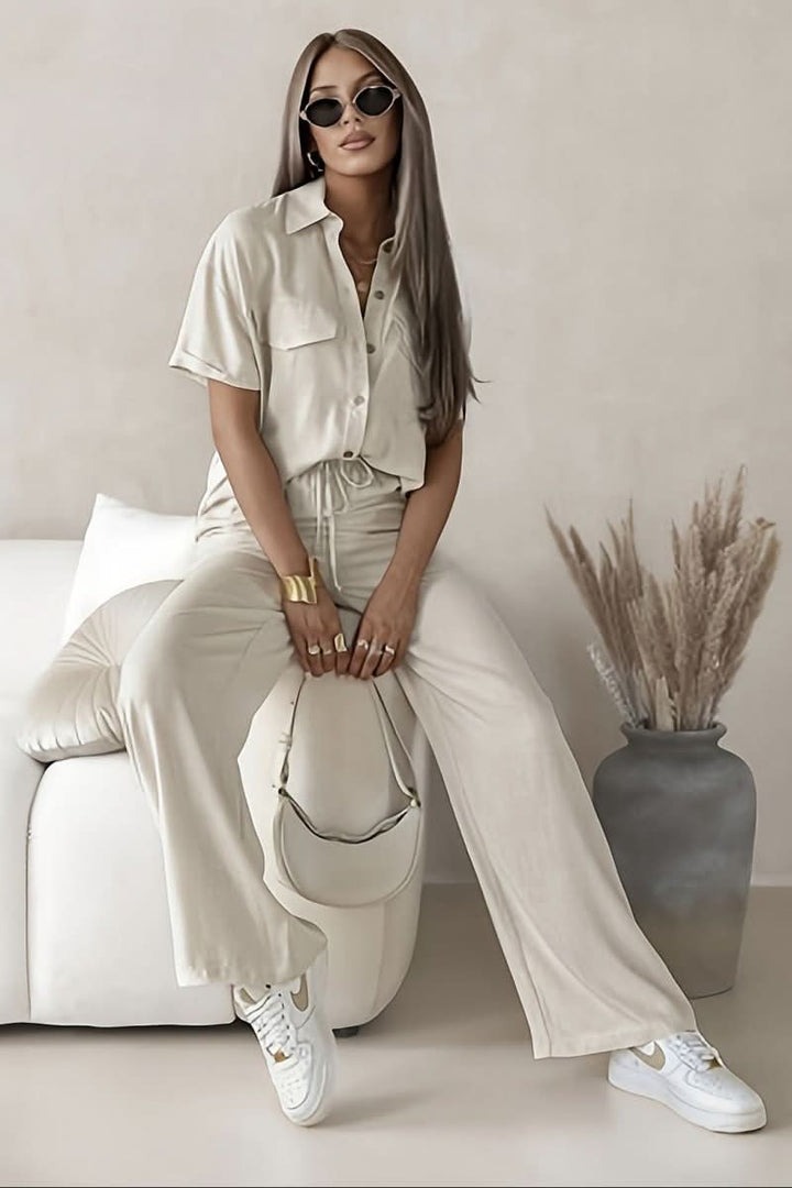 Chic women's minimalist two-piece coordinated set for elegant everyday wear. Versatile lounge outfit.