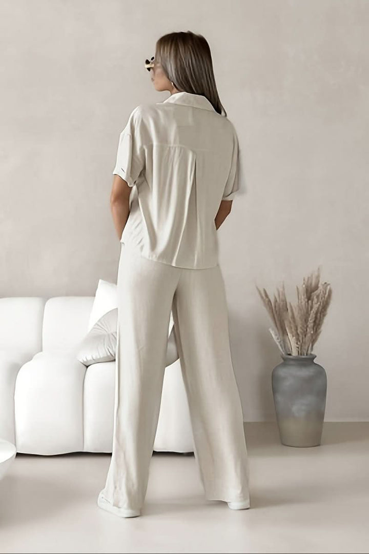 Women's minimalist two-piece set, featuring a stylish top & coordinated bottom. Chic & versatile loungewear.