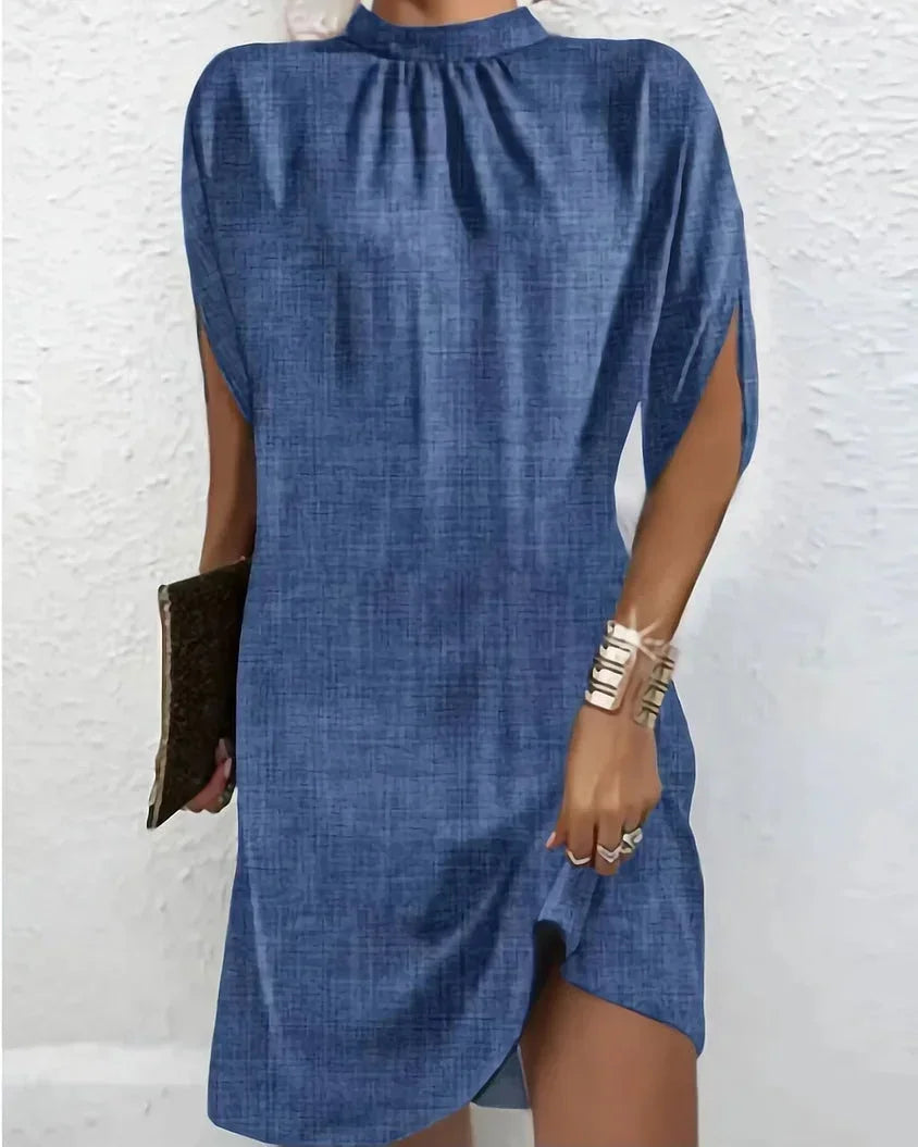 Chic women's mock neck mini dress with elegant cape sleeves. Perfect for parties & cocktails.