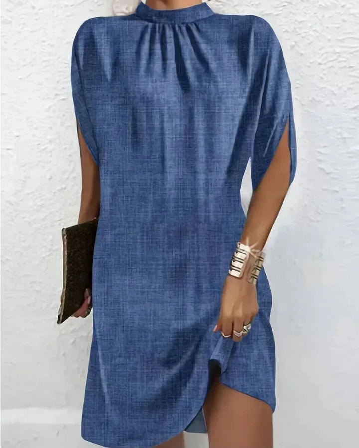 Chic women's mock neck mini dress with elegant cape sleeves. Perfect for parties & cocktails.
