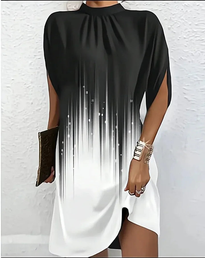 Versatile women's elegant mini dress. Features a mock neck, chic cape sleeves & a contemporary short design.