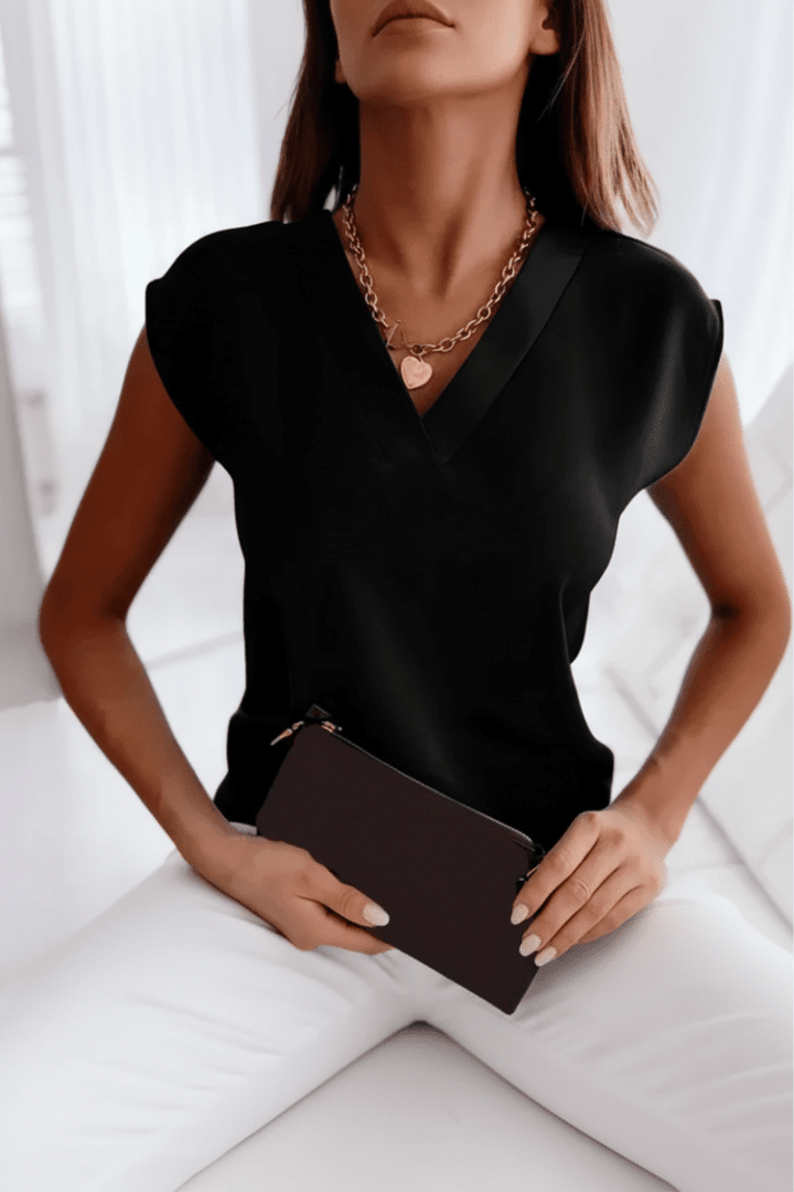 Relaxed fit women's open back top. Stylish sleeveless design, perfect for casual elegant summer going out fashion.