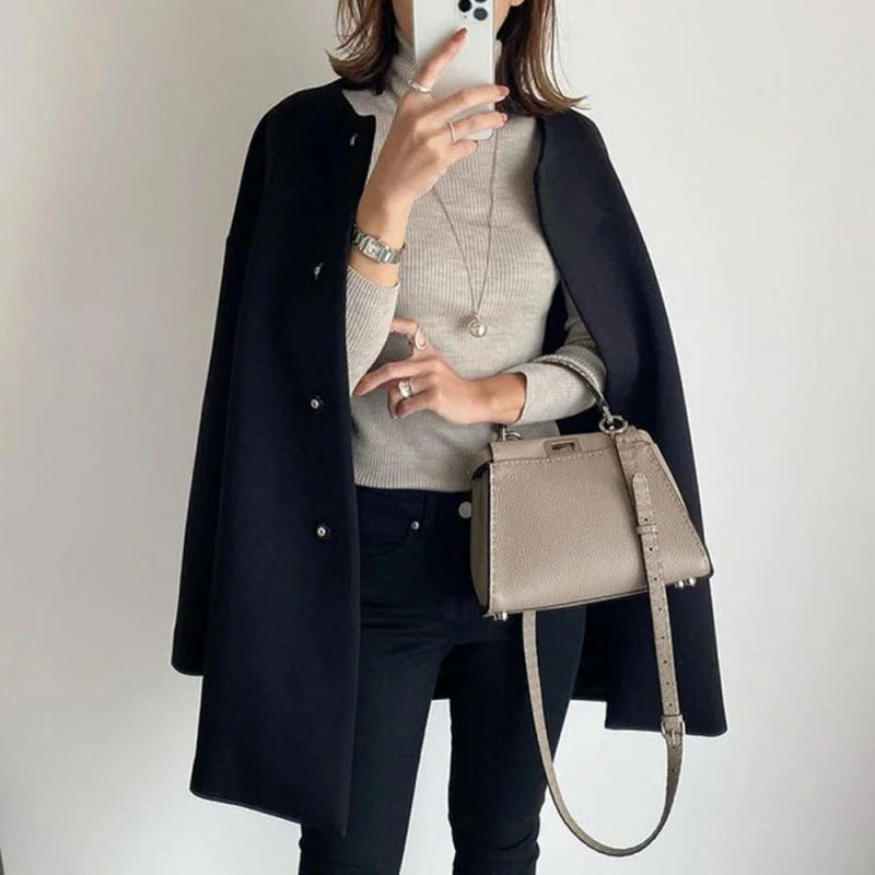 Stylish women's oversized button coat. Versatile elegant outerwear, great for streetwear or office fashion.