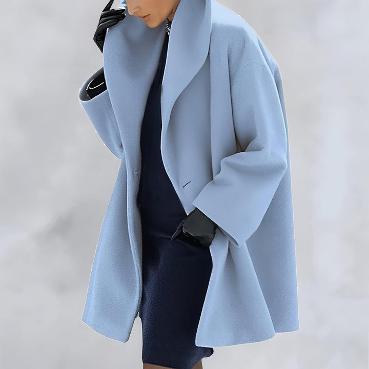 Fashionable women's oversized coat, a chic and elegant long outerwear piece. Ideal for timeless fall and winter style.