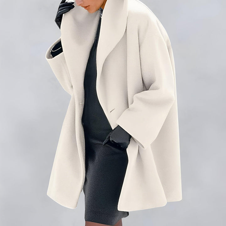 Modern classic women's oversized coat. Chic, versatile long outerwear, a timeless fall jacket and warm winter fashion staple.